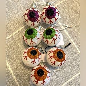 Seven (7) Halloween Glitter Bloodshot Eyeball Ornaments.